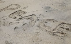 The word "peace" written on a beach. Wikimedia Commons/Yaw Kuma Ansu-Kyeremeh