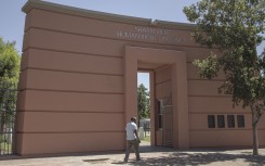 File: A man walks by the main entrance of the Sharpeville Heritage Memorial compound. AFP/Gianluigi Guercia
