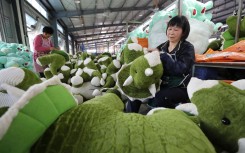 File: Chinese workers make soft toys to be exported to the United States and Europe. Imaginechina via AFP/Si wei