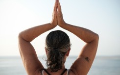 File: A woman doing a yoga pose. AFP/Hans Lucas/Valendino Belloni