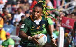 File: Rosko Specman of South Africa runs with the ball. AFP/Karim Sahib