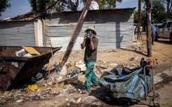 File: A waste picker seen in Diepsloot. AFP/Michele Spatari