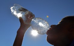 File: A boy drinks water from a plastic bottle. AFP/Picture-Alliance/Frank Hoermann/Sven Simon
