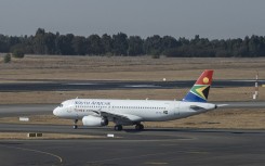 A SAA plane is seen on the tarmac before departing from the OR Tambo International Airport. AFP/Emmanuel Croset