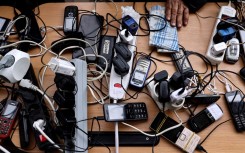 File: Cellphones being charged. AFP/Ronaldo Schemidt