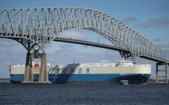 File: An outbound cargo ship passes under the Francis Scott Key Bridge in Baltimore. AFP/Mark Wilson/Getty Images