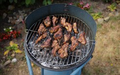 File: Meat grilled on a braai. Mathieu Thomasset/Hans Lucas via AFP