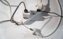 File: Multiple plugs in an electrical outlet. AFP/Jean-Marc Barrere/Hans Lucas
