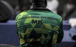 A man wearing a Umkhonto Wesizwe (MK) political party shirt. AFP/Gianluigi Guercia