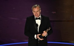 ritish director Christopher Nolan accepts the award for Best Director for "Oppenheimer". AFP/Patrick T. Fallon.jpg