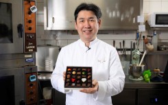 apanese chocolatier Yasushi Sasaki holds a box of chocolates. AFP/John Thys