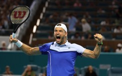 Grigor Dimitrov of Bulgaria celebrates after defeating Carlos Alcaraz of Spain. AFP/Al Bello/Getty Images