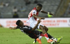 Katleho Maphathe of Cape Town Spurs tackled by Relebohile Mofokeng of Orlando Pirates. Sydney Mahlangu/BackpagePix