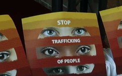 A sign urging people to stop human trafficking.