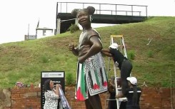 The statue of Hope was draped in Palestinian flag colours.