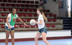 The netball players practicing.