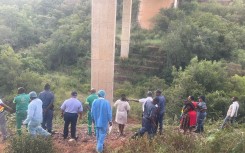 Onlookers and teams at the scene