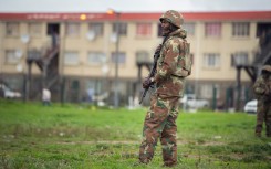 File: A SANDF soldier patrols a street in Hanover Park. AFP/Rodger Bosch