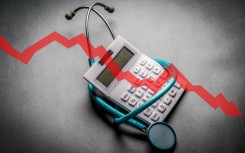 An illustration of a stethoscope around a calculator. GARO/Phanie via AFP