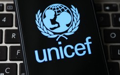 File: UNICEF logo is displayed on a mobile phone screen.
