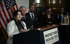 Leah Juliett, a survivor of sextortion, speaks at a press conference after the US Senate Judiciary Committee hearing. AFP/Brendan Smialowski