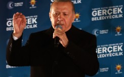 Turkish President and leader of Justice and Development (AK) Party Recep Tayyip Erdogan delivers a speech after the Turkish local Municipal elections. AFP/Adem Altan.jpg