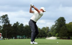 Rory McIlroy of Northern Ireland plays his shot from the first tee during a practice round prior to the 2024 Masters Tournament at Augusta National Golf Club on April 10, 2024 in Augusta, Georgia.