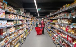 File: People shopping for groceries. Riccardo Milani/Hans Lucas via AFP