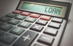 File: Calculator with the word loan. KTS/Science Photo Library via AFP