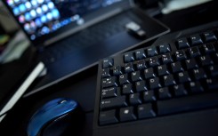 File: A home office desk with a keyboard, a mouse and a laptop. (AFP)