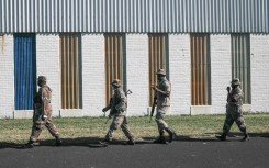 File: SANDF members on patrol. AFP/Guillem Sartorio