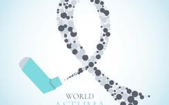 An inhaler with grey ribbon for asthma awareness day. AUM / Science Photo Library via AFP