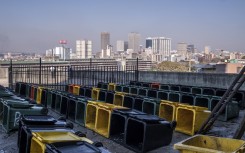 A general view of rubbish bins left out to dry at Ponte City. AFP/Emmanuel Croset