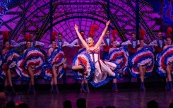 Dancers perform French Cancan on stage during a show at the Moulin Rouge musical cabaret in Paris. AFP/Miguel Medina