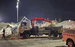 Emergency and disaster teams are scrambling to rescue dozens more still unaccounted for. AFP/Willie van Tonder