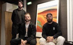 Obvious Artists collective members pose in front of the first print from their "Mind-to-Image" project. AFP/Thomas Samson