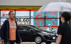 Electronic boards displaying the Nikkei index of the Tokyo Stock Exchange. AFP/Kazuhiro Nogi