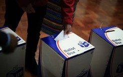People cast their ballots papers as they vote in the South African general election, at the South African High Commission in central London. AFP/Benjamin Cremel
