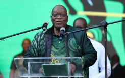 Former president Jacob Zuma addresses supporters at Orlando Stadium in Soweto. AFP/Phill Magakoe