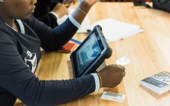 An IEC official scans the identity card of a voter. AFP/Rajesh Jantilal