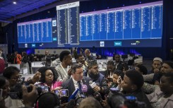 Leader of the Democratic Alliance (DA), South African main opposition party, John Steenhuisen (C) speaks with the media at the Independent Electoral Commission (IEC) National Results Center in Midrand on May 31, 2024. 