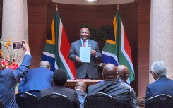President Cyril Ramaphosa signs the National Health Bill into Law