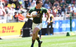 File: South Africa's Impi Visser runs the ball during a HSBC World Rugby Sevens Series match. AFP/Rodger Bosch