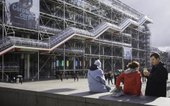 File: Tourists in front of the iconic Pompidou Centre museum in Paris. Eric Broncard/Hans Lucas via AFP