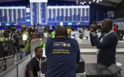 File: An IEC staff member leans against a booth at the Independent Electoral Commission (IEC) National Results Center in Midrand on May 31, 2024. 