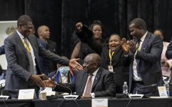 President of the African National Congress (ANC) Cyril Ramaphosa (C) is congratulated by Deputy president of the African National Congress (ANC) Paul Mashatile (L) after he was announced president after members of parliament voted during the first sitting of the New South African Parliament in Cape Town on June 14, 2024.