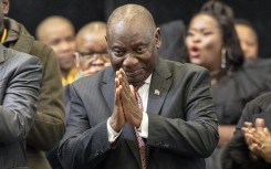 President of the African National Congress (ANC) Cyril Ramaphosa (C) gestures after he was announced President after members of Parliament voted during the first sitting of the New South African Parliament in Cape Town on June 14, 2024. 