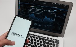 File: A LSE (London Stock Exchange) logo seen on a smartphone and an Exchange graph. AFP/Nikolas Kokovlis / NurPhoto