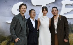Actor Glen Powell, director Lee Isaac Chung, actors Daisy Edgar-Jones and Anthony Ramos attend Universal's "Twisters" premiere. AFP/Valerie Macon