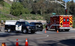 File: California Highway Patrol officers control traffic. Sean M. Haffey/Getty Images via AFP